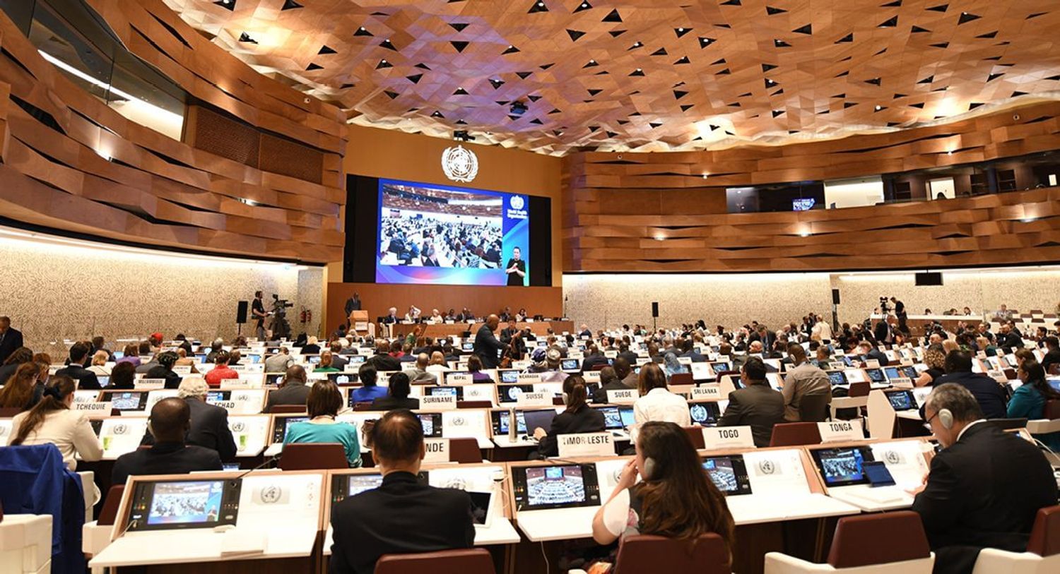 Delegates seated in the main hall at the forum