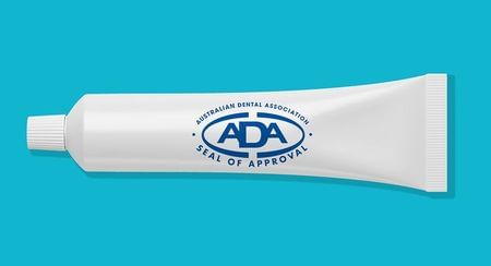 Plain white toothpaste tube with ADA's Seal of Approval logo