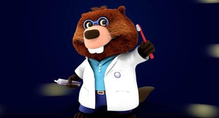 World Oral Health Day mascot holding up a toothbrush