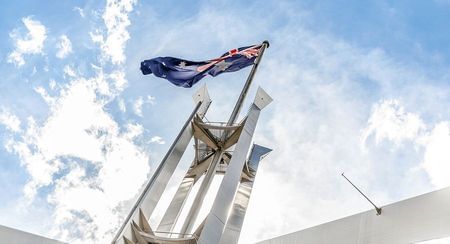 Looking up at the huge flagpole atop Parliament House Canberra
