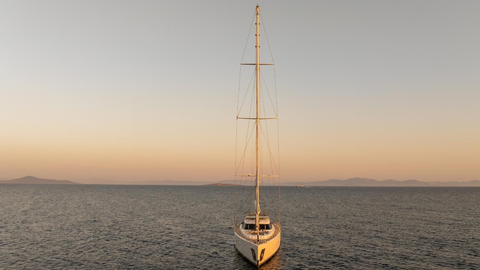 sailing yacht jasmina cruising during sunset