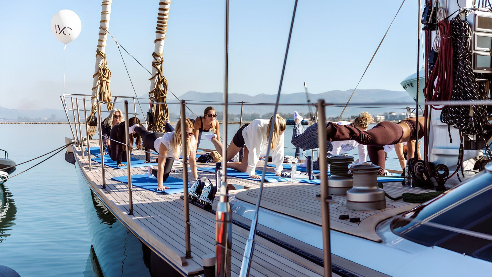 a yoga session onboard an iyc yacht