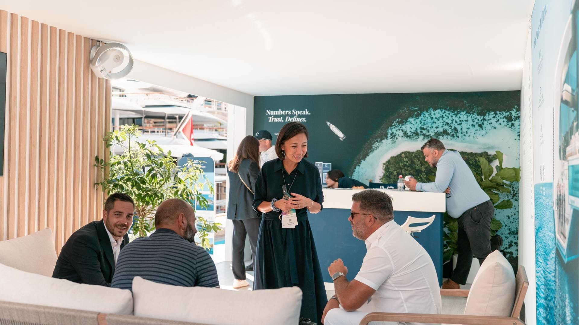 a group of people sitting at the iyc lounge during the MYS 2025