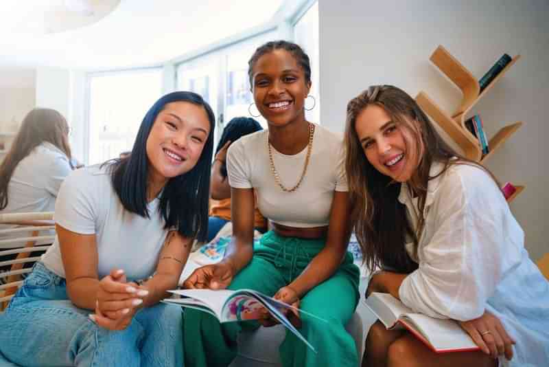 Students studying a foreign language together in a cozy library.