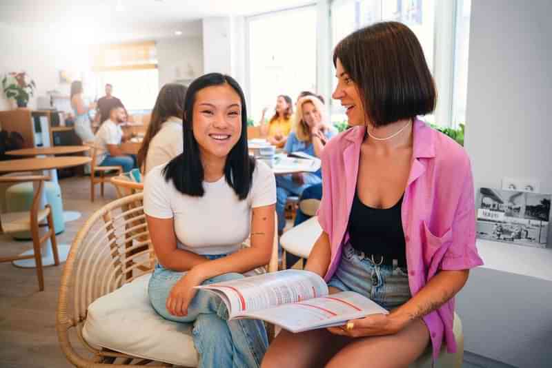 People engaging in language learning inside a café-like setting.