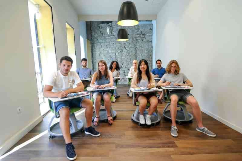 Students in a classroom likely participating in a language travel program.