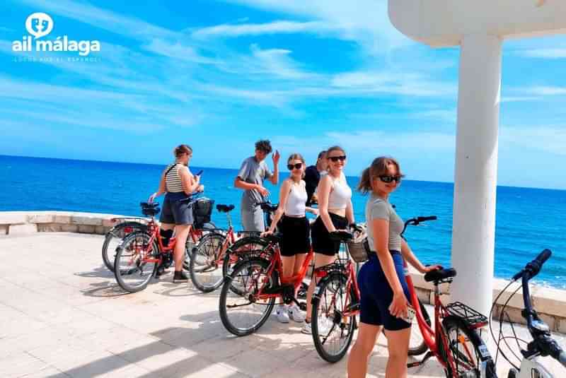 Language students on a coastal bike tour in Málaga, Spain.