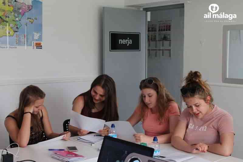 Students studying Spanish together in a classroom setting.