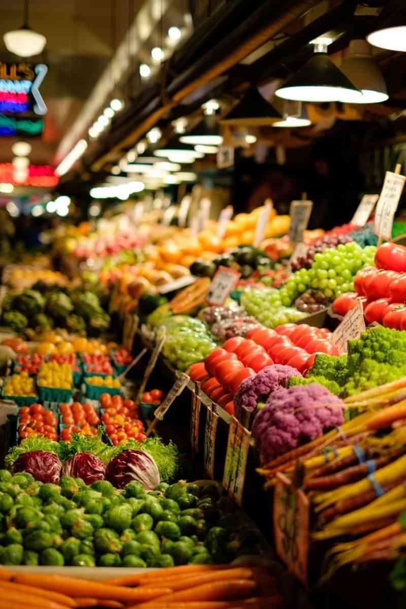 Colorful fruits and vegetables at a local market, ideal for immersion.