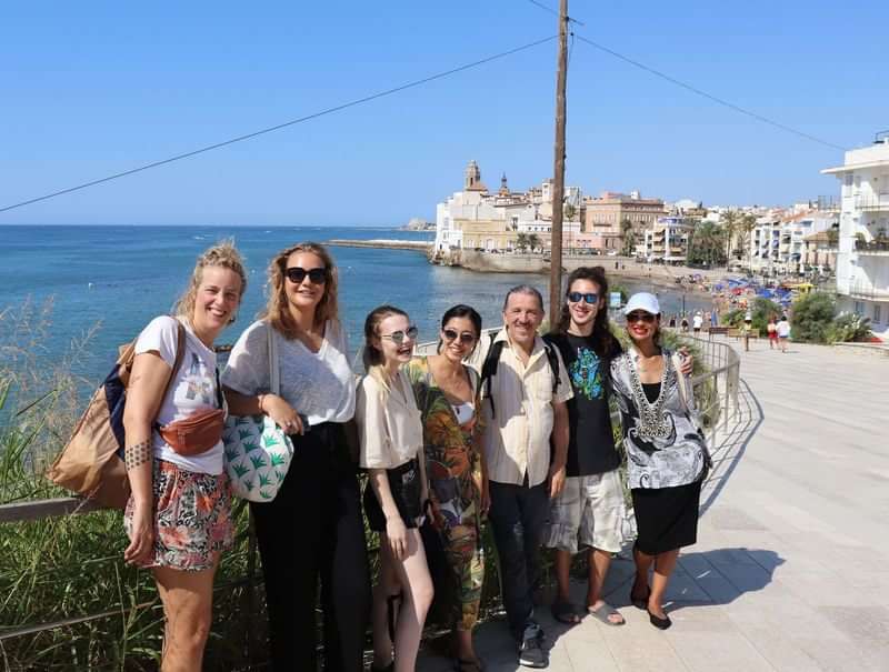 A group of travelers enjoying a coastal town in a language immersion trip.