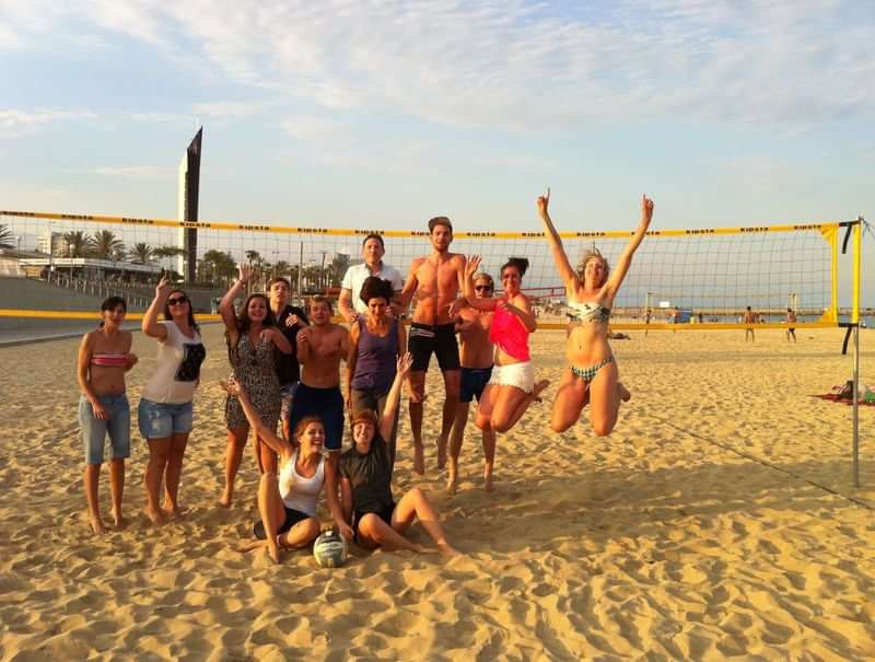 Beach volleyball with classmates during a language travel trip.