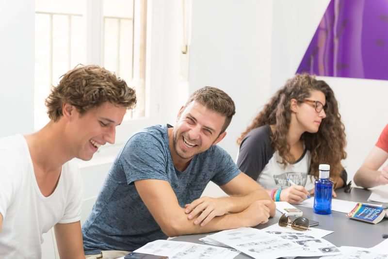 Students engaged in a lively language class during travel abroad.