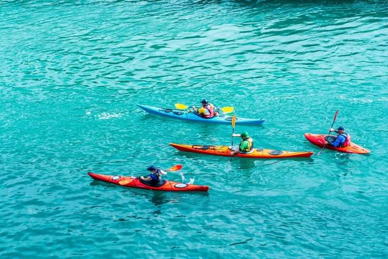 Kayaking and adventure travel in stunning turquoise waters, embracing local experiences.