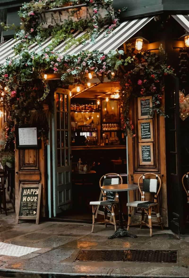 Cozy café with outdoor seating, perfect for language practice over coffee.