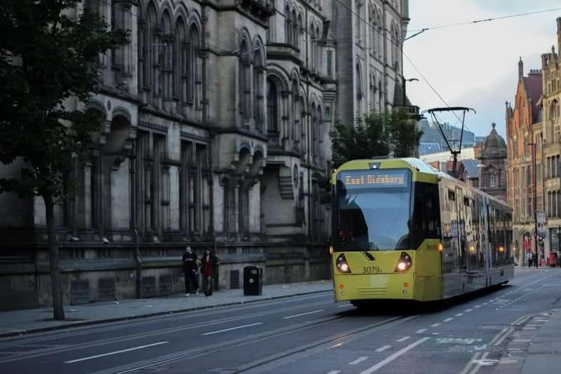A tram moving through a European city, ideal for practicing English.