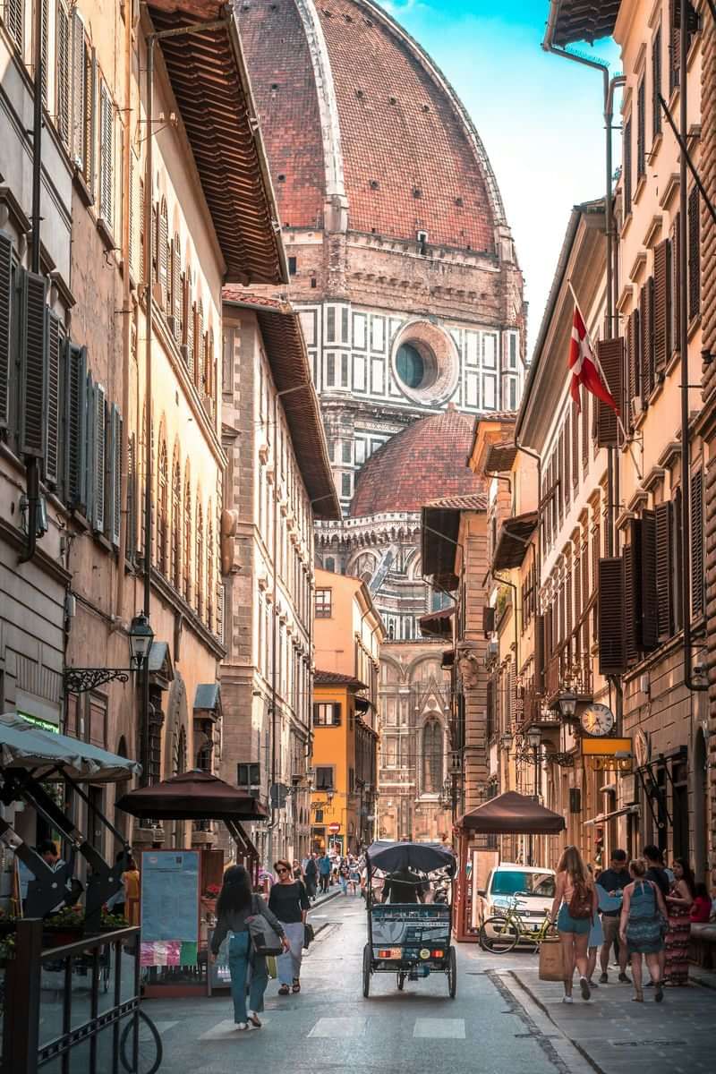 Exploring historic streets near Florence Cathedral, vibrant cultural and language immersion.