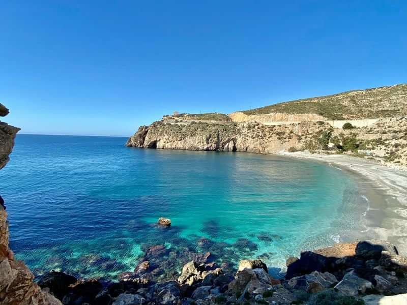 Turquoise waters and rocky beach, Mediterranean coast, picturesque language learning retreat.