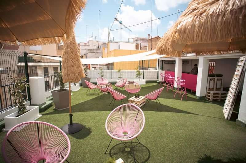 Rooftop lounge in a vibrant city, ideal for language immersion.