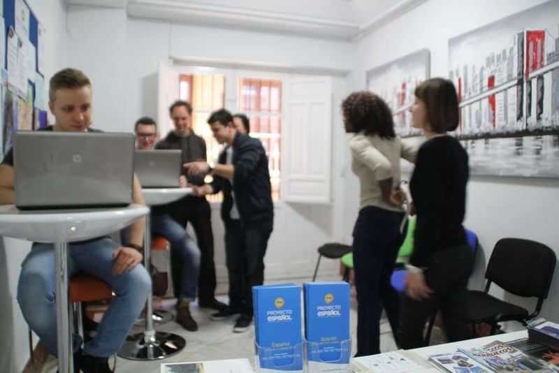 Students interacting and studying at a language school or learning center.