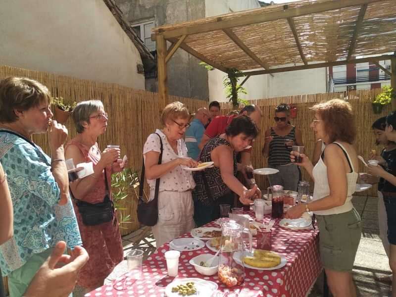 Group of people enjoying a local food exchange during travel.
