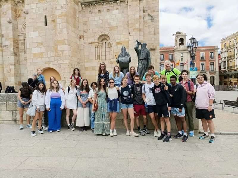 A group of students in a Spanish town on a trip.