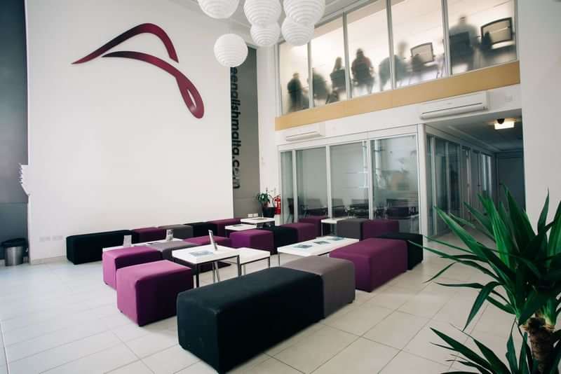 Language school lobby with modern seating and study areas.