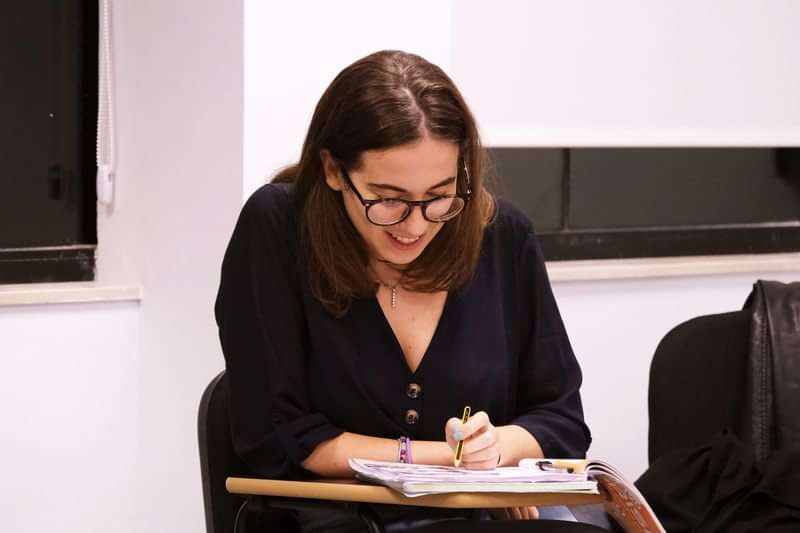 Student studying, immersed in a foreign language learning environment.