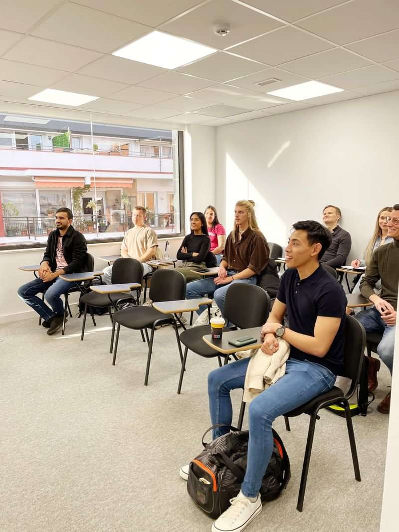 Students in a language class, possibly learning for travel purposes.