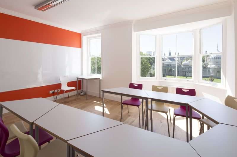 Bright classroom with whiteboard for language travel programs and courses.
