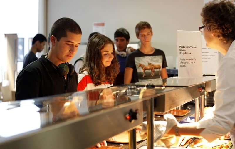 Students at a cafeteria, likely part of a language travel program.