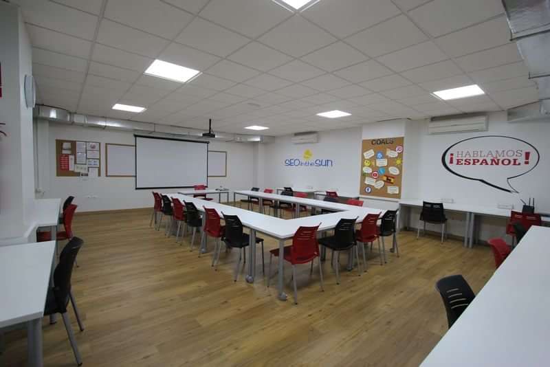 A classroom set up for a Spanish language learning session.