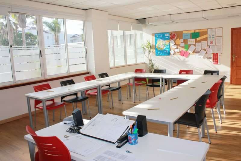 Bright classroom in language school, ready for engaged language learning sessions.