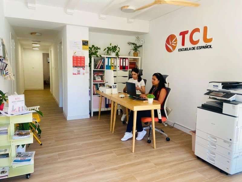 Spanish language school office with staff working at desks.