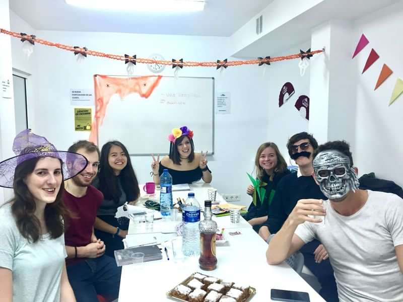 Group of students in costume at a festive language class.