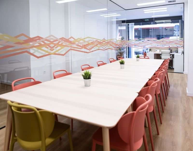 Language school classroom with desks and chairs for group lessons.