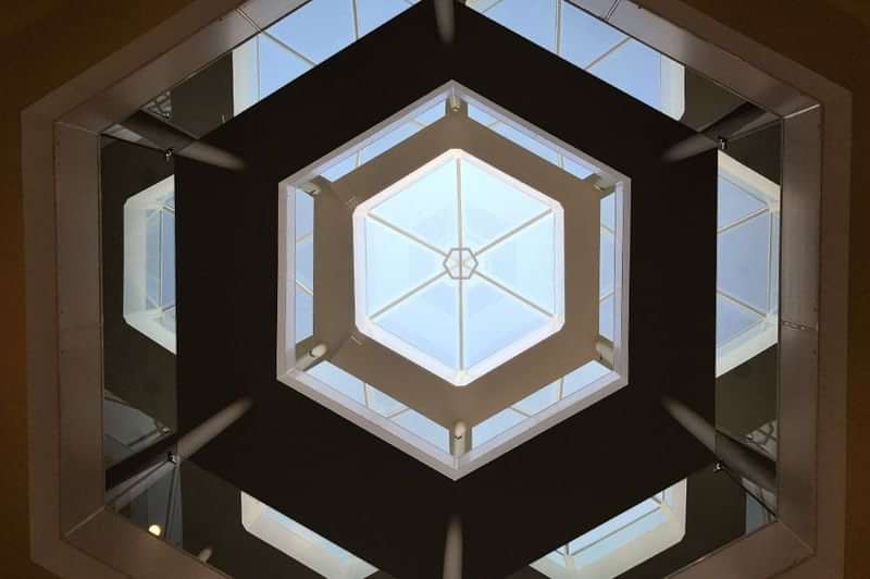 A skylight window in a building, view from below.