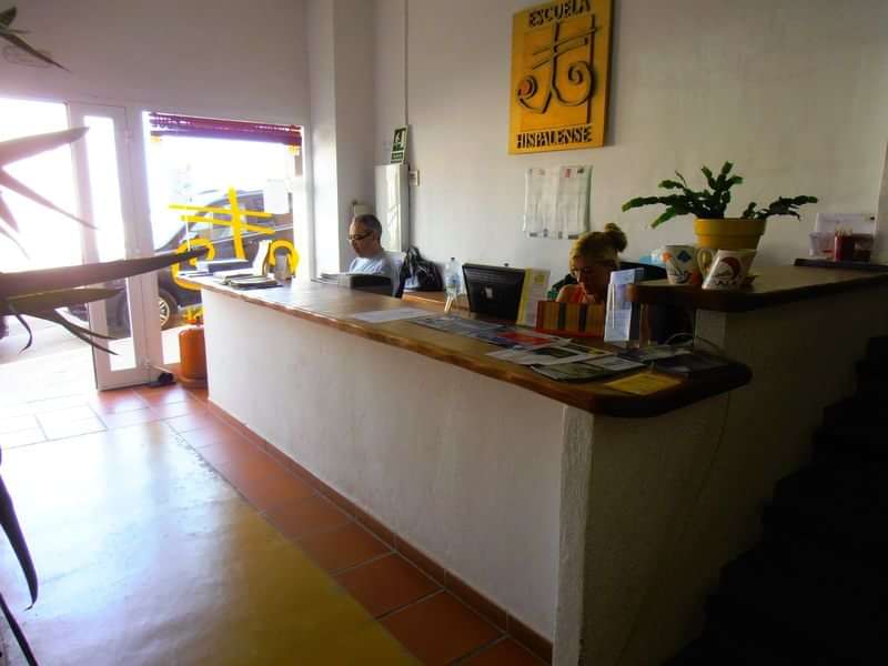 Reception desk at language school with informational brochures.