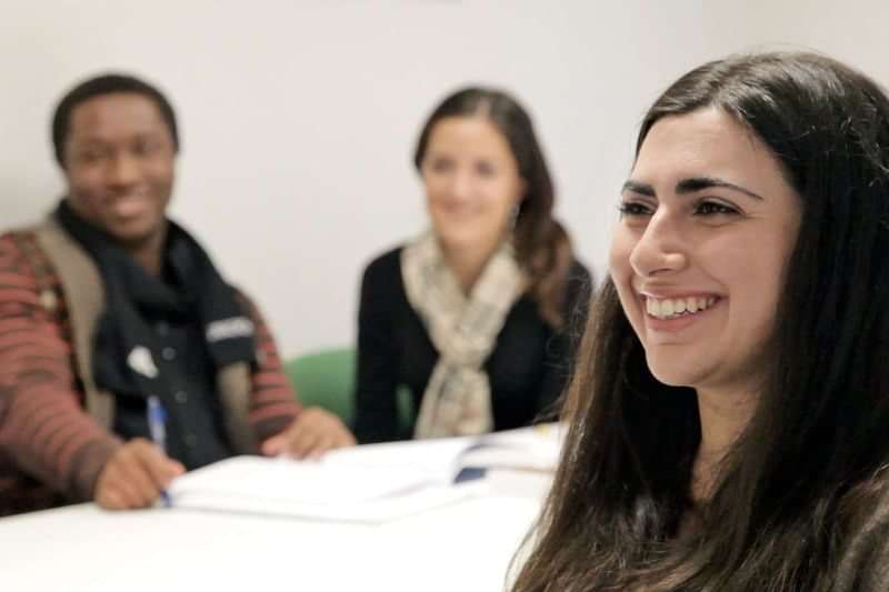 Students in a classroom enjoying a language travel learning experience.