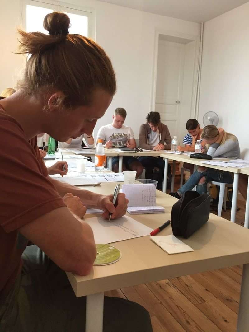 Students in a language class, possibly studying abroad or learning a language.