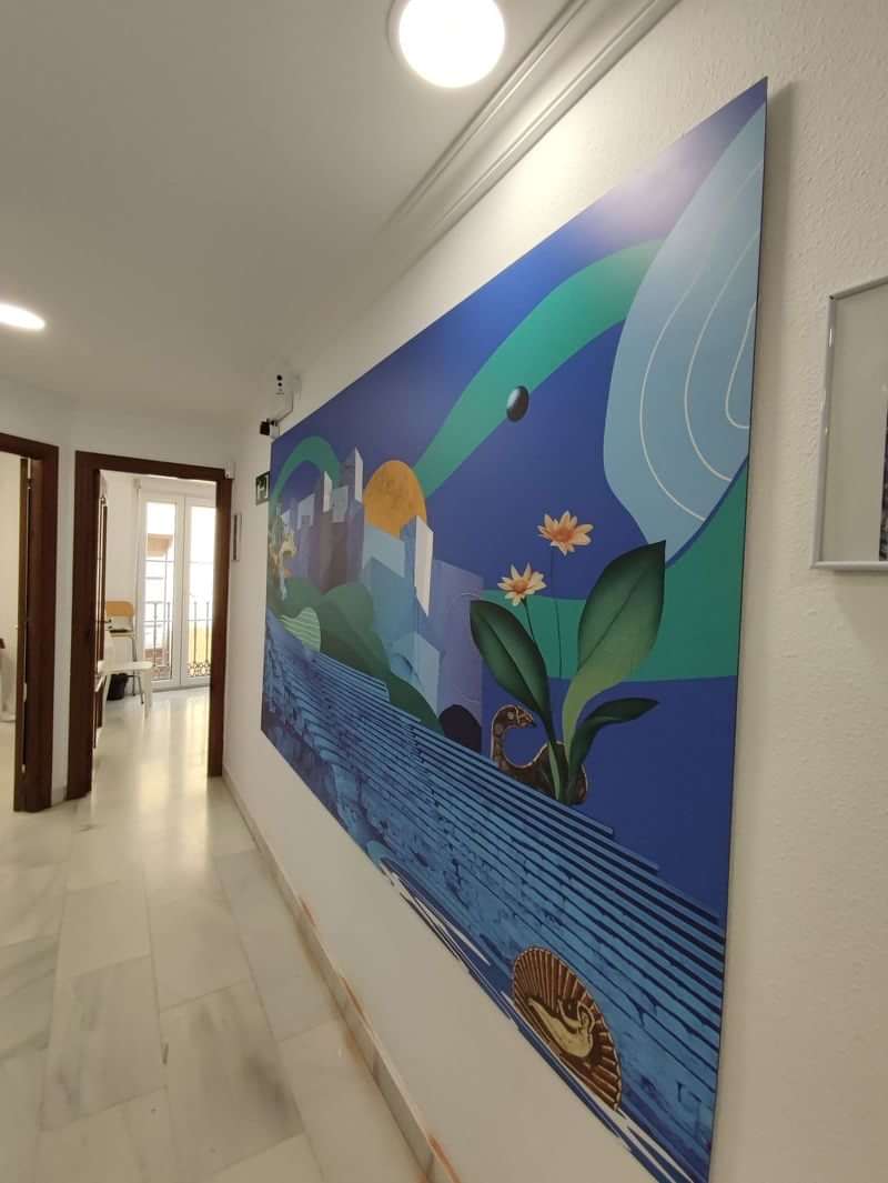 Colorful mural in a language school's bright hallway with natural light.