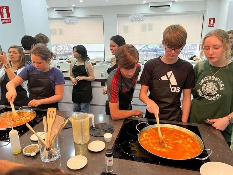 Students participating in a cooking class while traveling abroad.