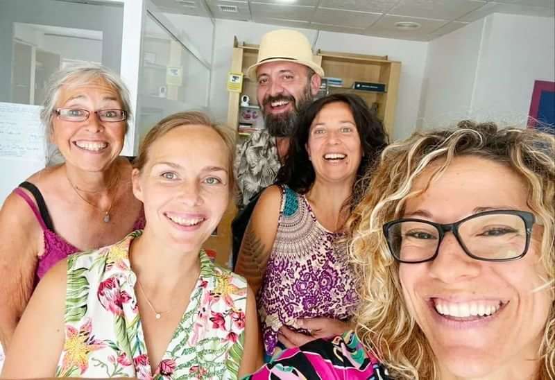 A group of happy people at a language school or travel program.