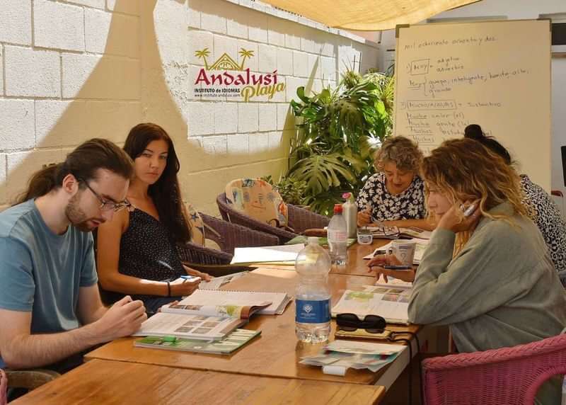Students engaged in a Spanish language class at Andalusí Playa.