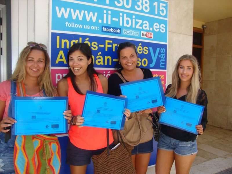 Students display language course certificates outside an educational center.