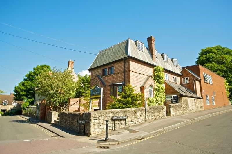 Historic building in a quaint English village, ideal for immersive language learning.