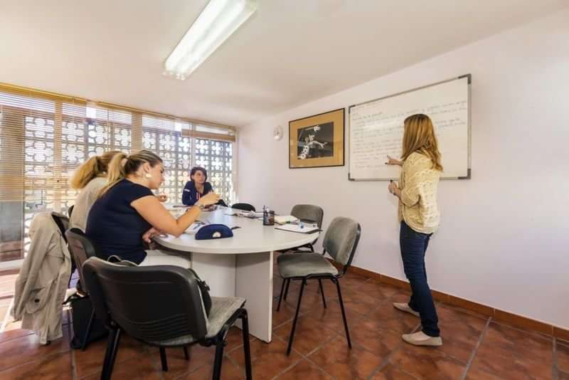 Small group in language class during educational travel.