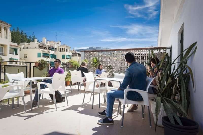 Language students enjoying an outdoor café during their travel program.