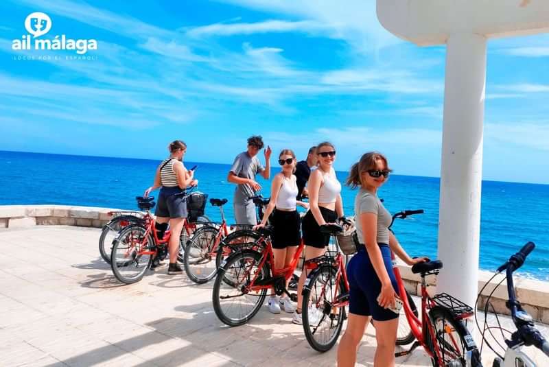 Language students on a coastal bike tour in Málaga, Spain.