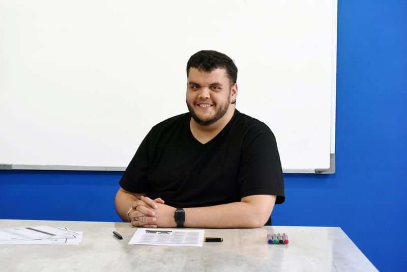 Teacher conducting a language class, ready for interactive learning experiences.