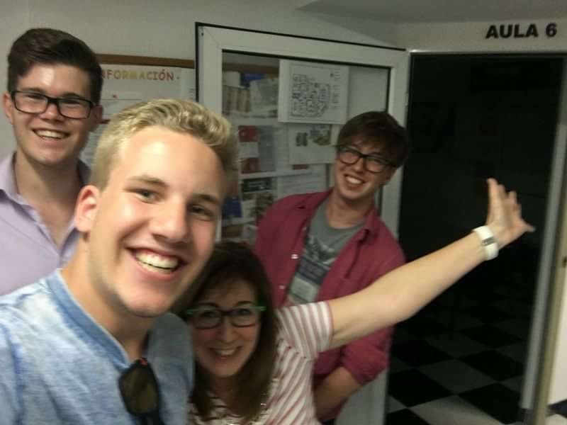 Group of friends at a language school, smiling and having fun.